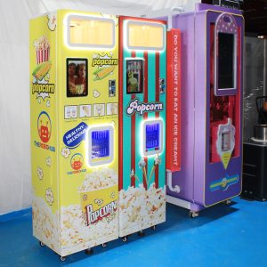 Large commercial popcorn machine in a concession stand, popping fresh popcorn.