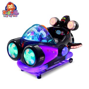 Colorful spaceship-themed kiddie ride designed for children, featuring vibrant lights and sound effects