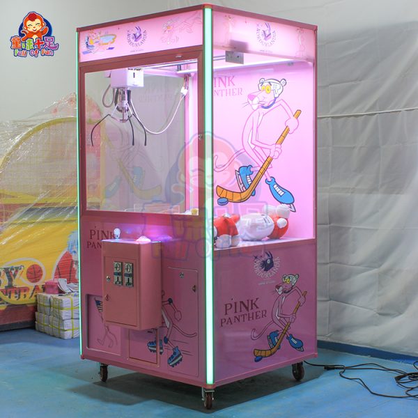 Pink Panther-themed claw machine designed for kids, featuring vibrant colors and playful design elements, perfect for amusement parks and family entertainment centers.