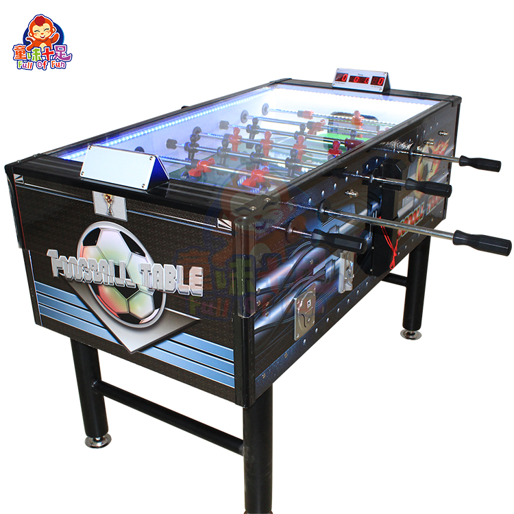 Coin-operated table football machine for kids and adults, perfect for arcades and entertainment venues.