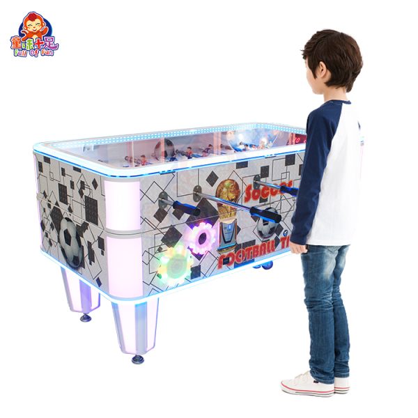 Coin-operated table football machine for kids and adults, perfect for arcades and entertainment venues.