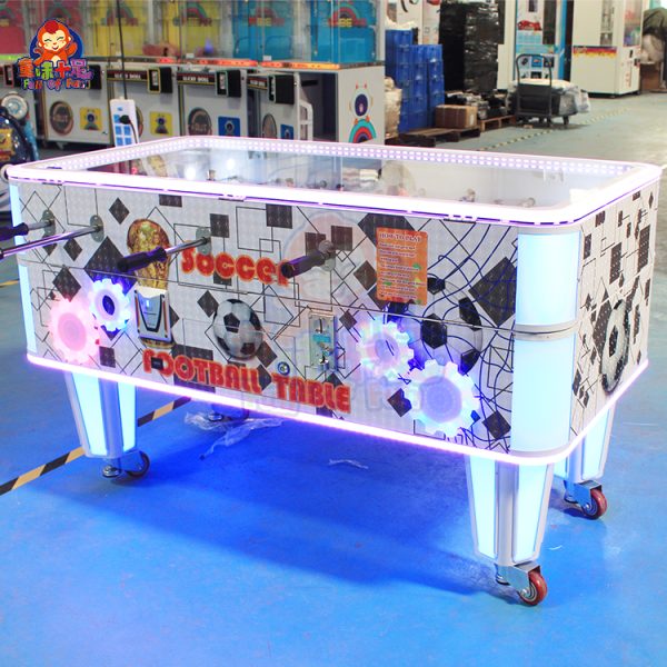 Coin-operated table football machine for kids and adults, perfect for arcades and entertainment venues.