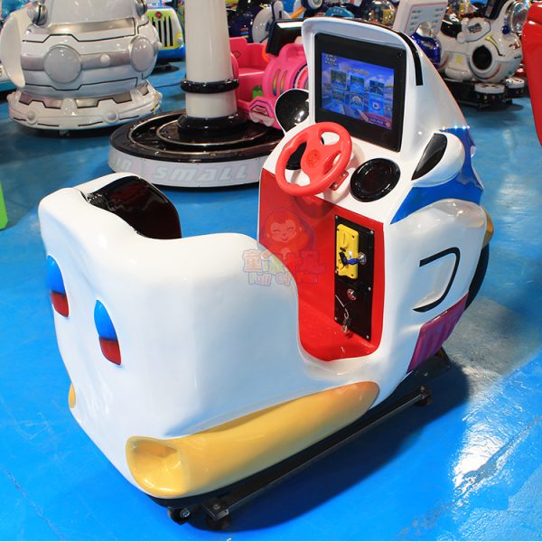 Colorful children's motorcycle kiddie ride machine in a play area