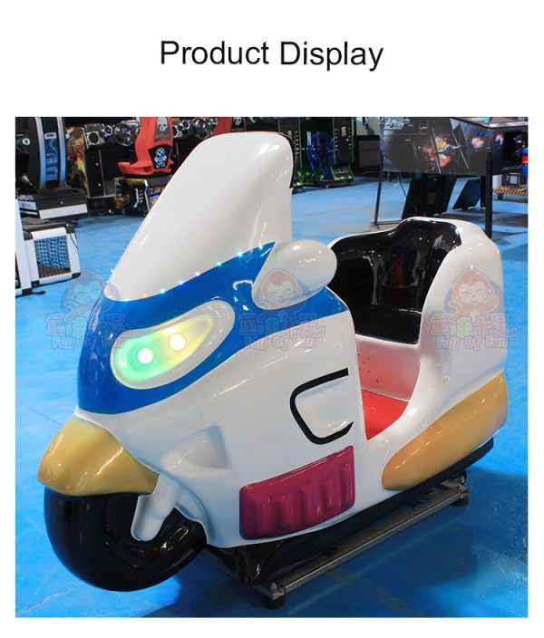Colorful children's motorcycle kiddie ride machine in a play area