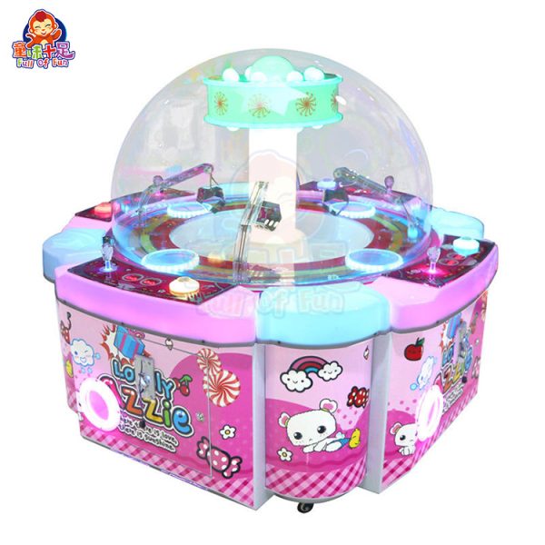 Four-player claw machine with four control panels and colorful lights.