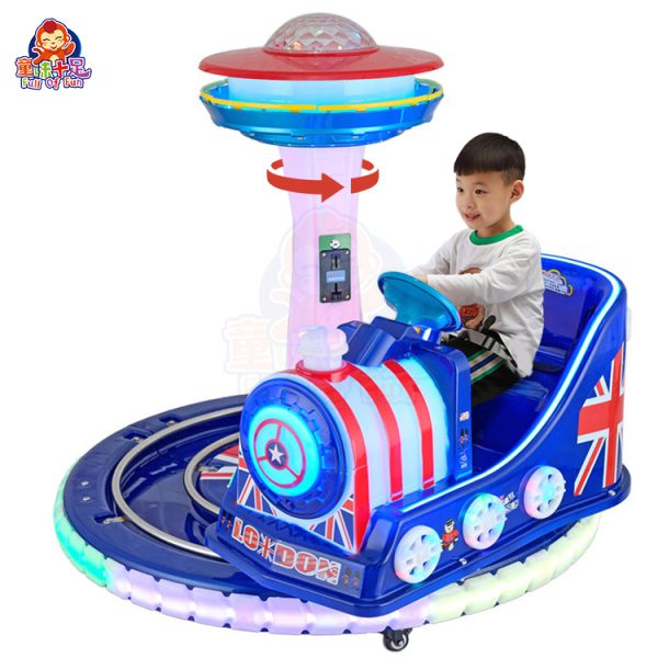 Rotating train kiddie ride on a circular track with colorful lights and sound effects.