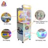 Clamp gift machine with rotating disk holding multiple prizes.
