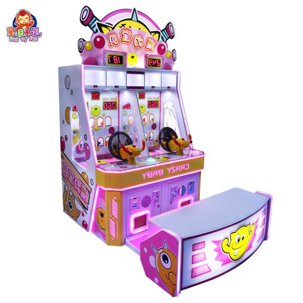 Child playing with the Magic Baby ball-shooting game machine in a colorful arcade.