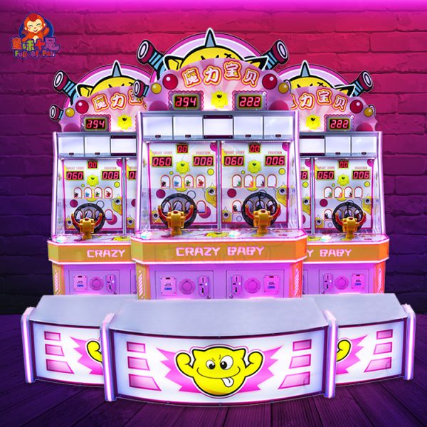 Child playing with the Magic Baby ball-shooting game machine in a colorful arcade.