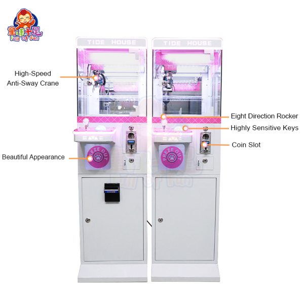 Mini claw machine with vibrant lights and small plush toys inside.