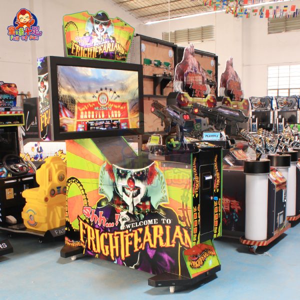 Two-player coin-operated horror-themed shooting game machine with vibrant lights and toy guns.