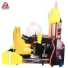 Two-player arcade racing game machine with dual seats, steering wheels, and colorful LED lights.