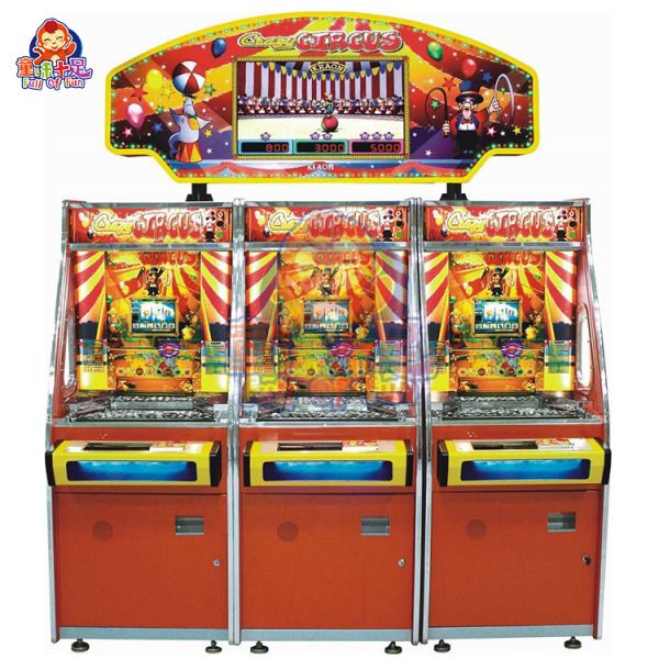 Three-player circus-themed coin pusher machine with vibrant lights and sound effects.