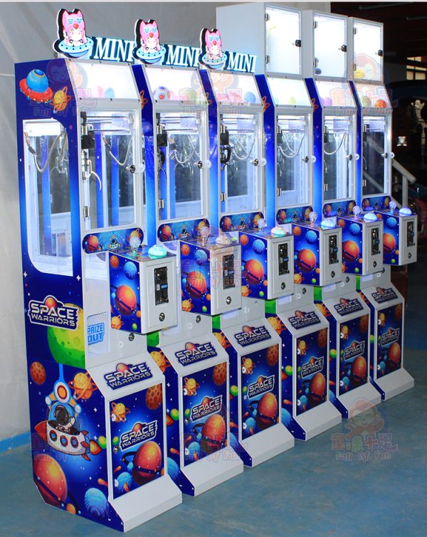 Mini claw machine with colorful plush toys, perfect for home or arcade use.