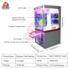 Compact coin-operated mini claw machine for children’s amusement.