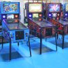 Custom pinball machine with ultra-high-definition LED screens and dynamic RGB lighting, designed for arcade and entertainment venues.
